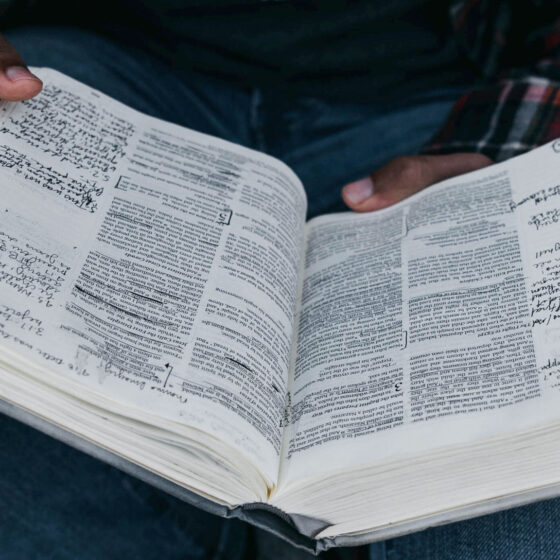 Man holding open Bible