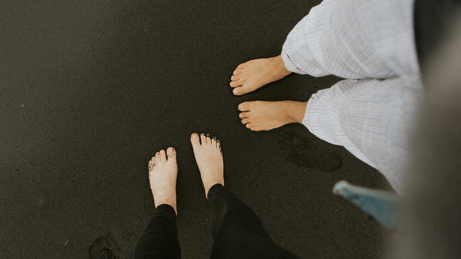 Bare feet on dark background