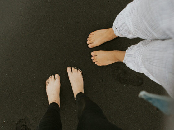 Bare feet on dark background