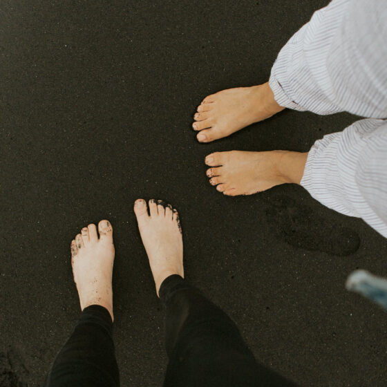 Bare feet on dark background