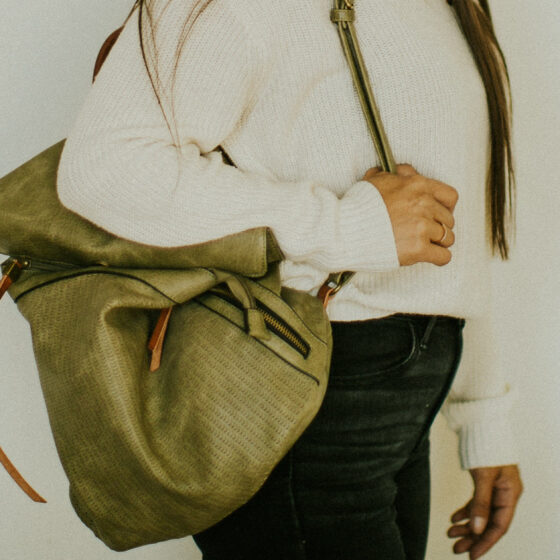 Women holding green bag
