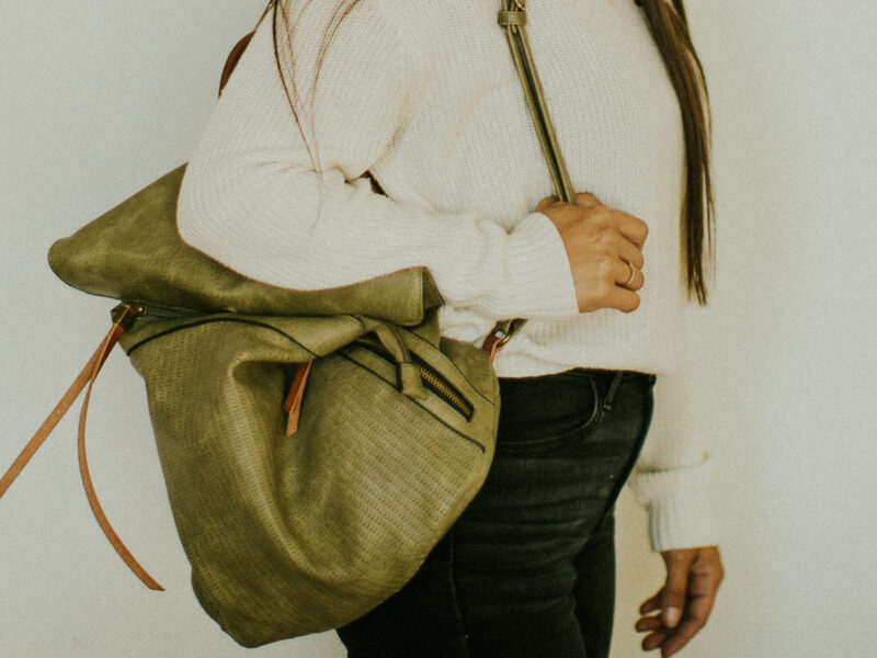 Women holding green bag
