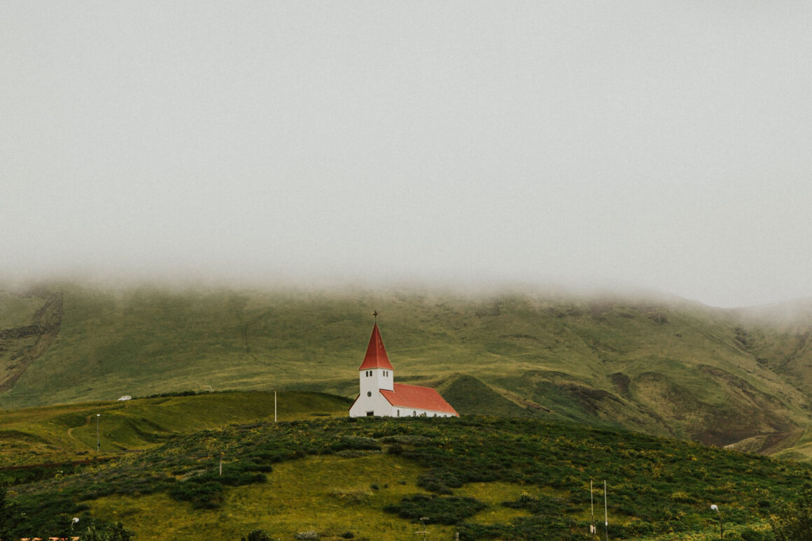 White church on a green hill