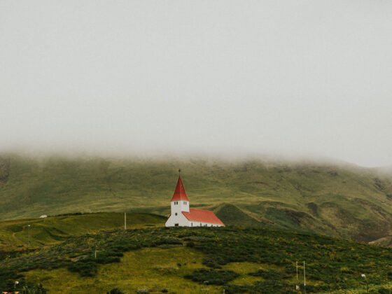 White church on a green hill
