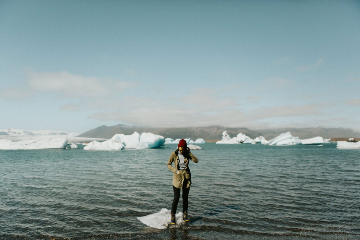 Woman standing on ice in a body of water